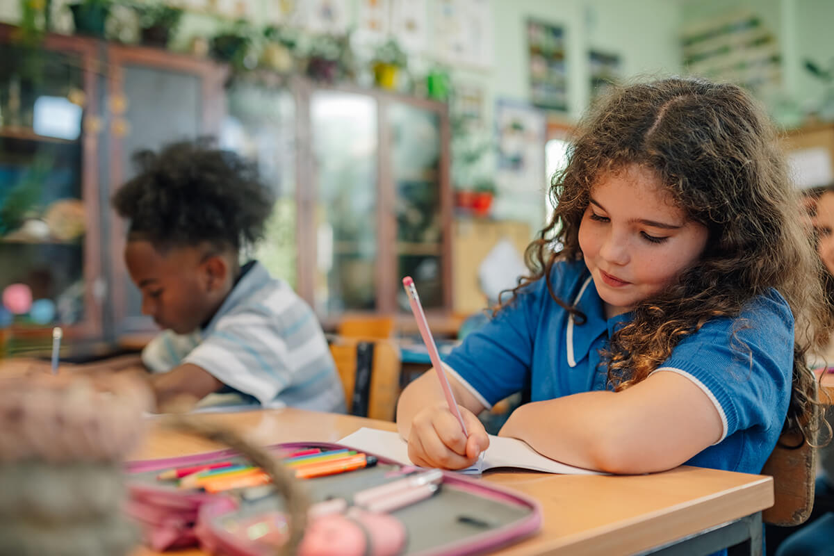 elementary school students working