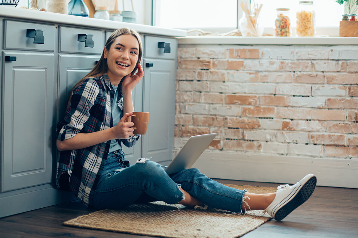 woman sitting on kitchen floor
